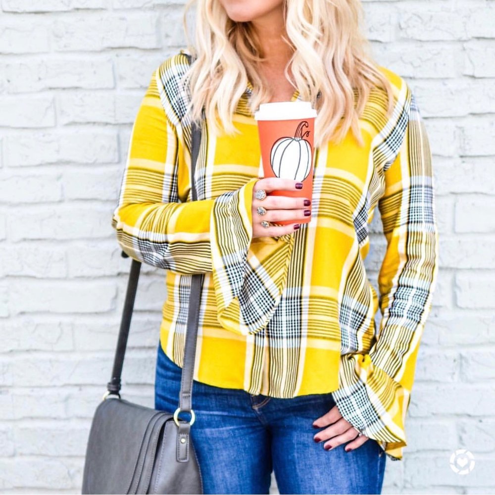    This flare-sleeved plaid top  comes in four colors and is now 52% off!  